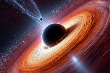 Representação gráfica de pequeno buraco negro no disco de acreção de um supermassivo (fonte: Francesco Tombesi)